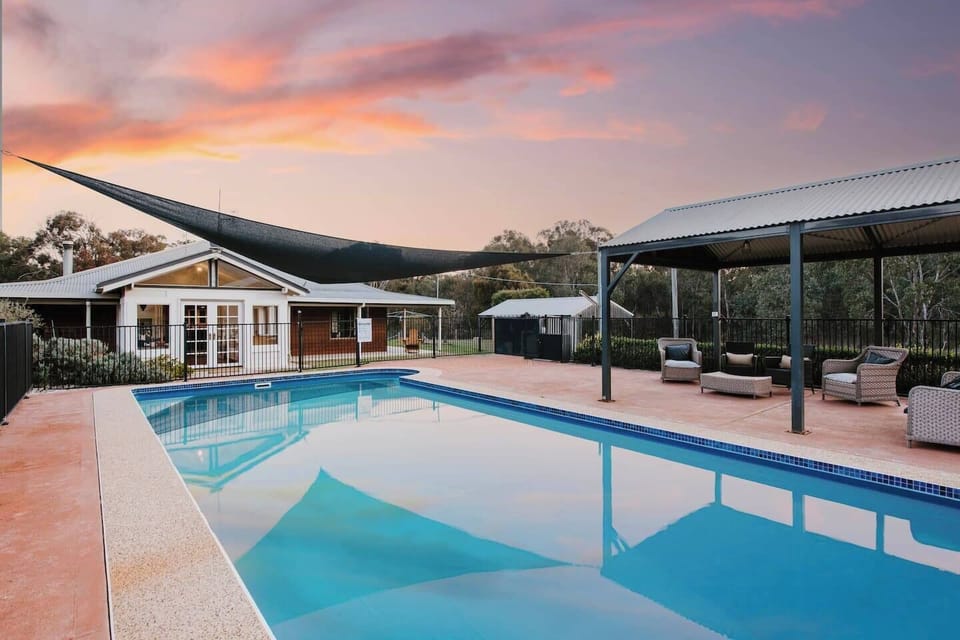 Cool down with a refreshing dip in the generous in-ground pool, or simply relax poolside with a good book in the undercover seating area.

