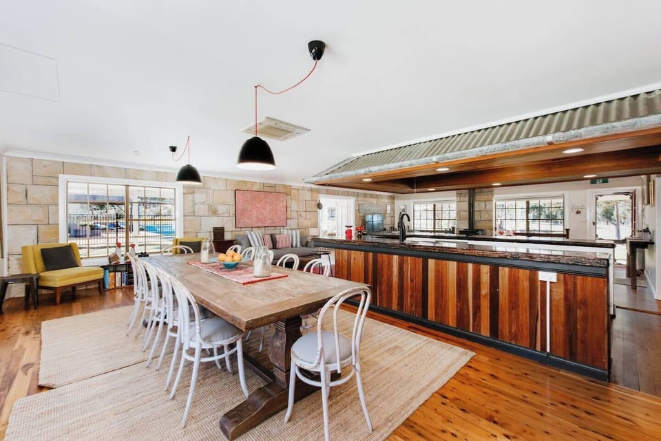 Share meals at the 12-person dining table and make use of additional seating available at the breakfast bar.
