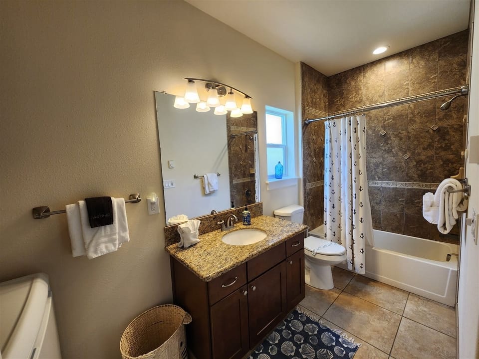Bathroom downstairs with washer and dryer