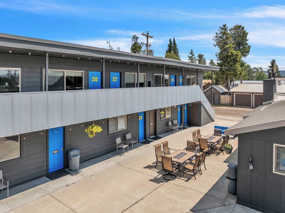Outside patio with outdoor furniture and view of room from second floor