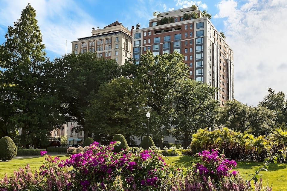 Stroll through blooming gardens to your elegant city escape.