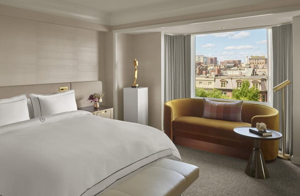 Unwind in a sunlit suite with sweeping city views.