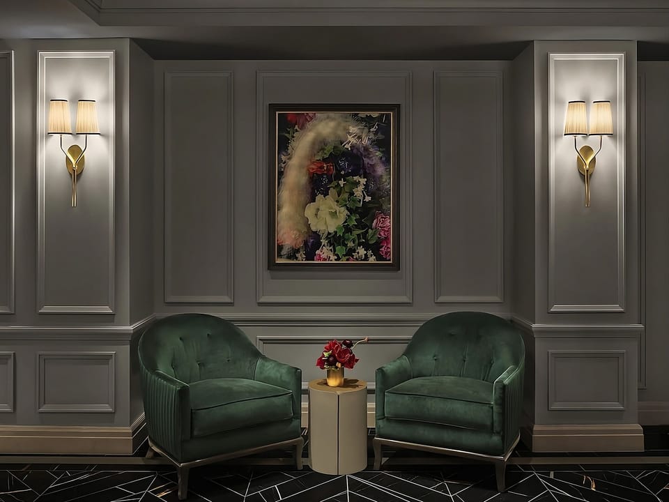 Unwind in cozy velvet seating beneath warm, ambient lighting.
