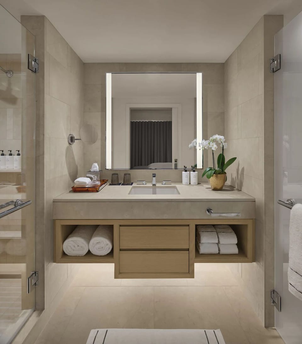 Get ready with generous towel storage and bright mirror lighting.