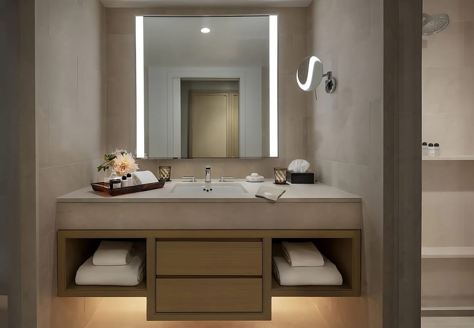 Refresh at a glowing vanity with spa-like countertop space.