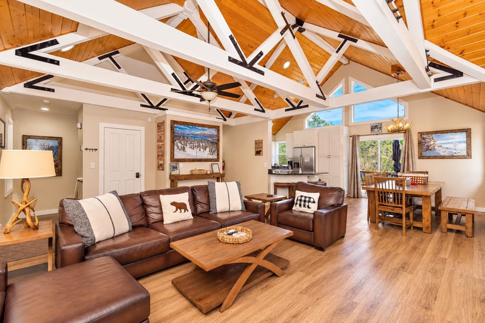 Gather beneath soaring timber ceilings in a bright, open living space where everyone can cook, dine, and reconnect after a day exploring Big Bear.