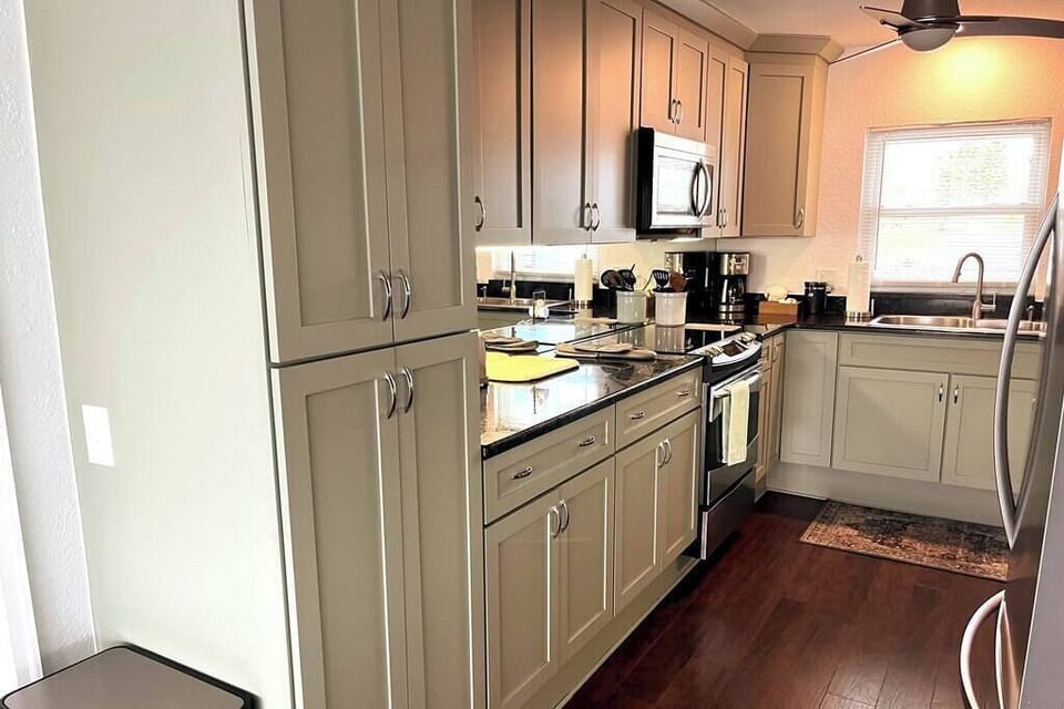 Kitchen has built-in microwave and lots of cabinets