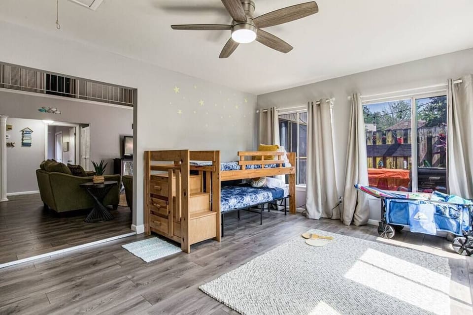 Play and bedroom space off living room