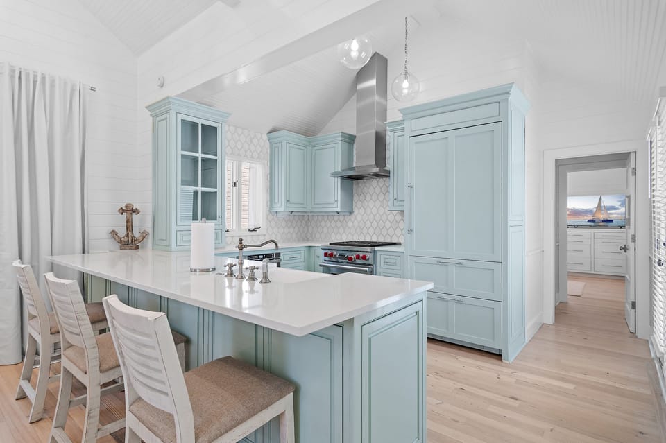 The beautiful custom kitchen boasts a Wolf Range and SubZero Refrigerator/Freezer.  Tucked away are a SubZero wine cooler and Wolf microwave.