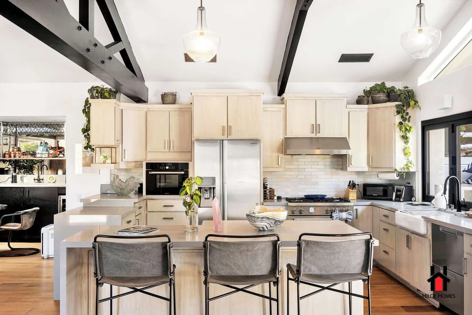 Elevate your cooking in this modern, fully-equipped chef's kitchen with island seating