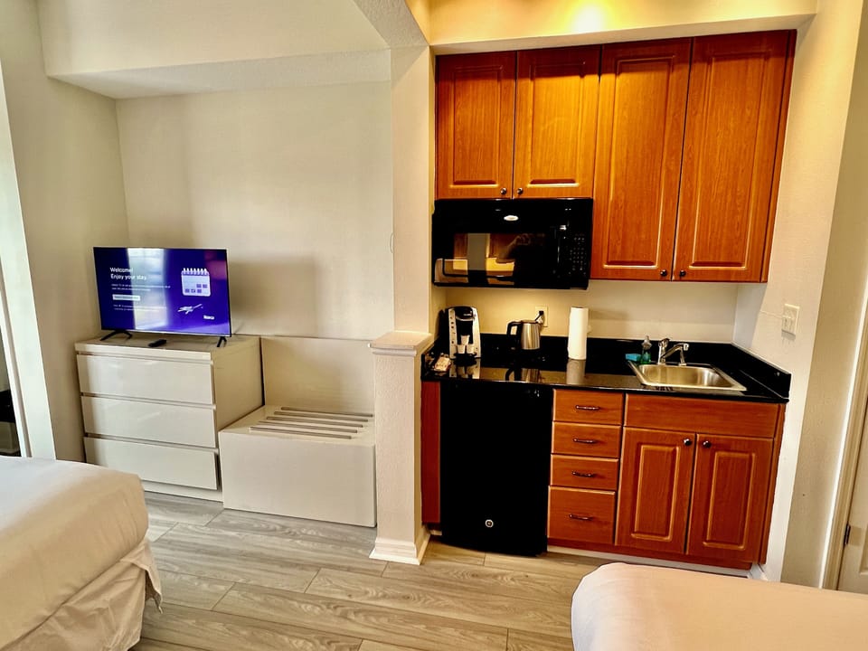 Premium Hotel room, two king beds, kitchenette, Wi-Fi, desk, Full Tile Bath