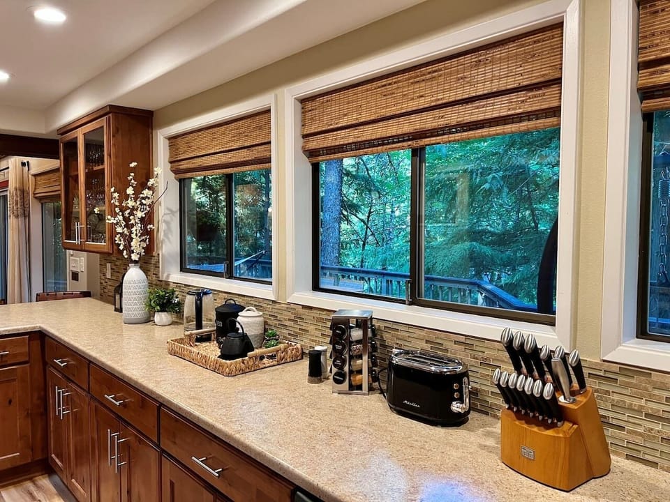 Expansive Kitchen with a view of Back Deck and Sandy River