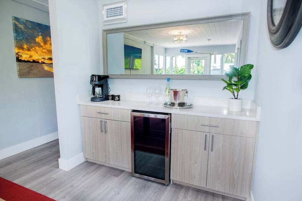 Enjoy this bright bonus room, complete with mini fridge and beverage station!