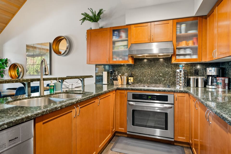 Open concept Kitchen + Bar seating for 4 + dining room table with seating for 8