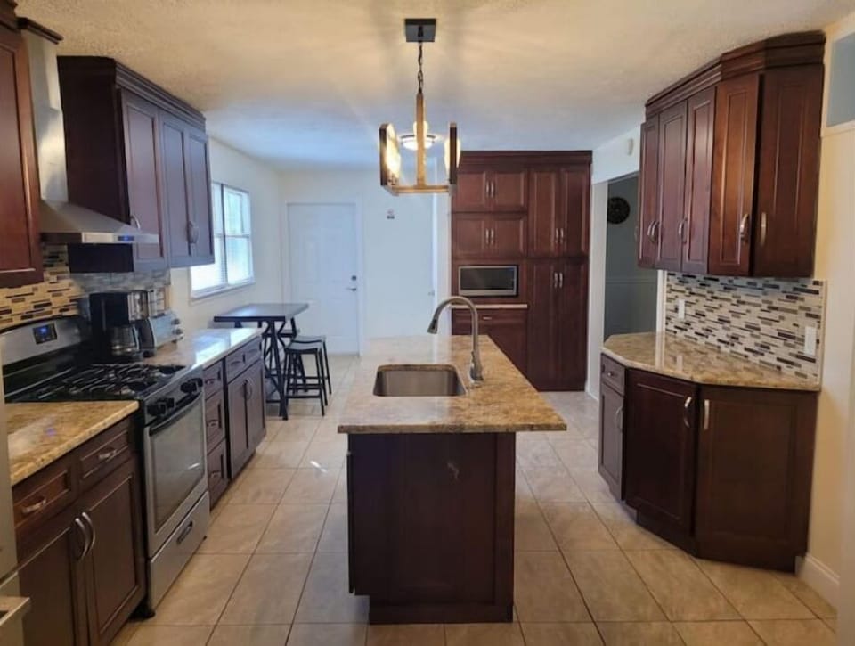 This is where the magic happens. Beautiful large kitchen with appliances.