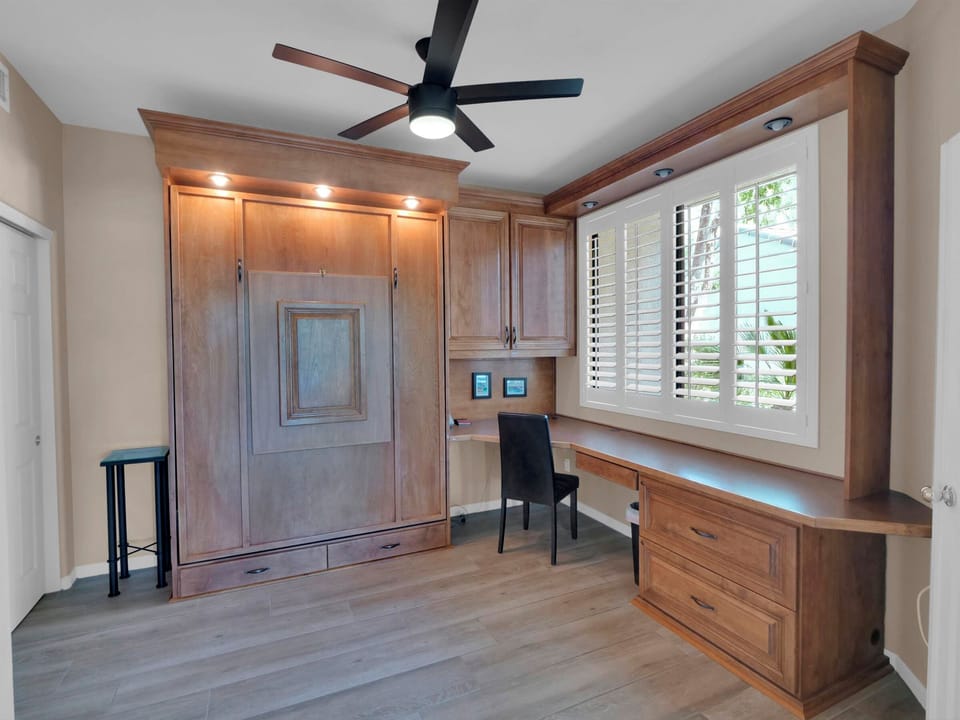 Den with Queen Murphy bed for guests.