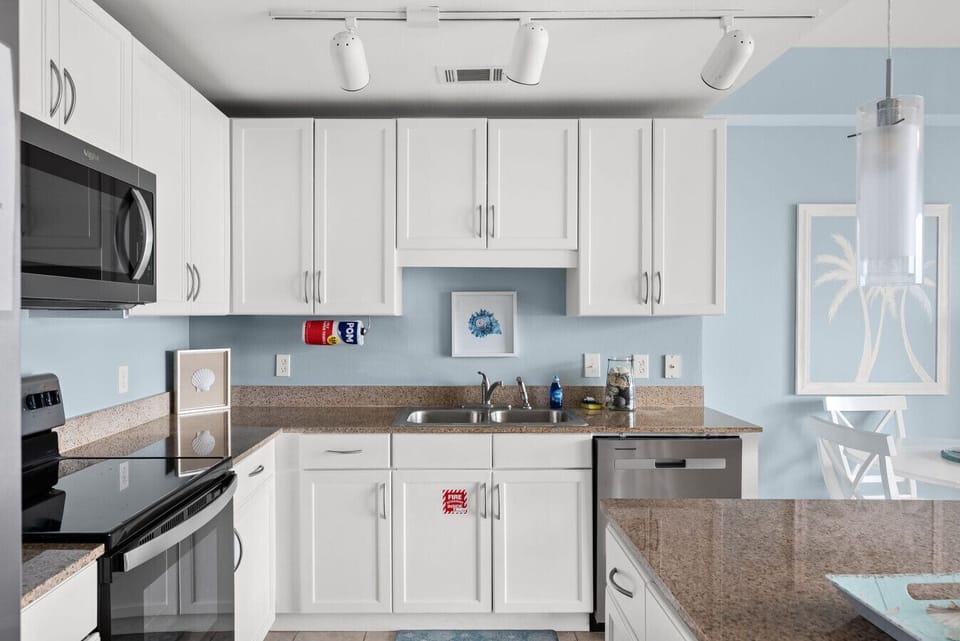 Fully equipped kitchen with modern appliances and plenty of counter space for easy meal prep.
