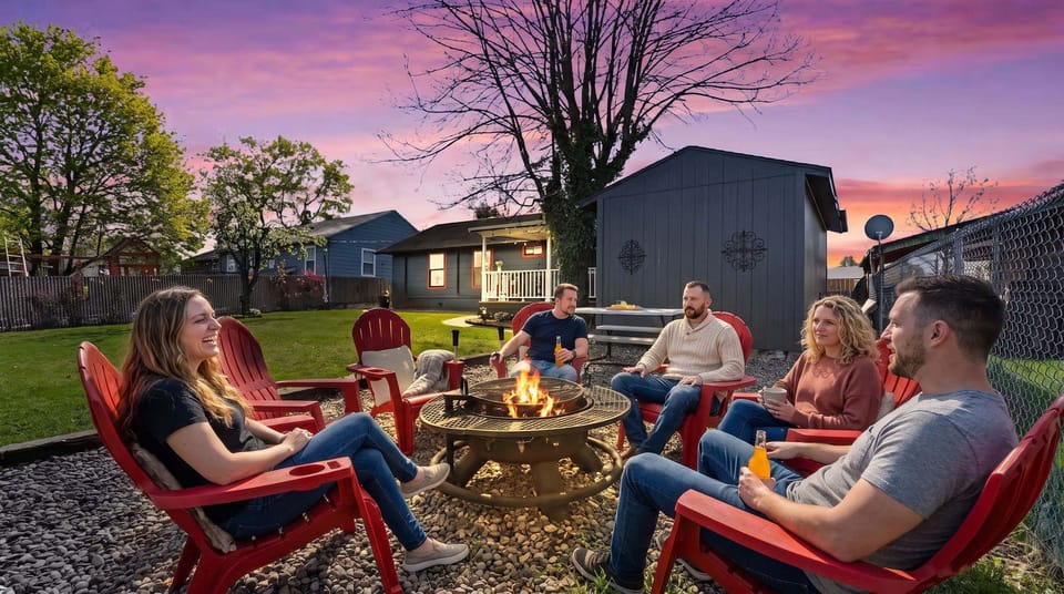Cozy backyard fire pit with Adirondack seating for unforgettable sunset evenings