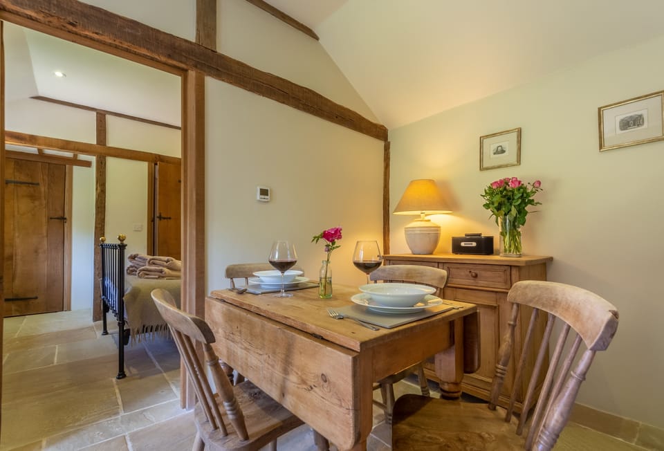 Ground floor: Fresh cut flowers adorn the dining area which seats four guests