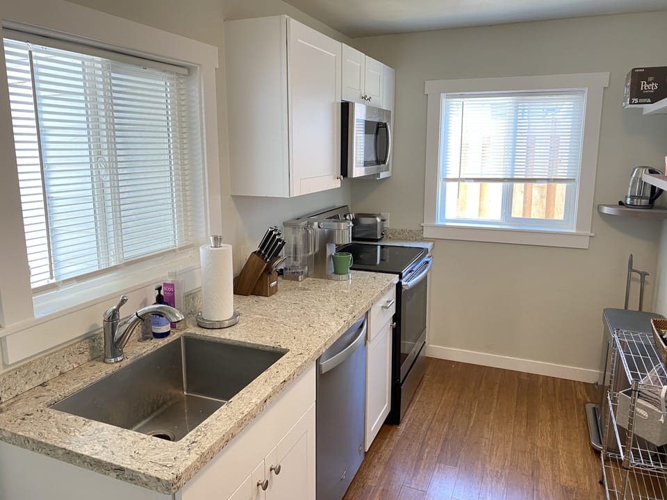 Quartz countertops, stainless steel appliances.