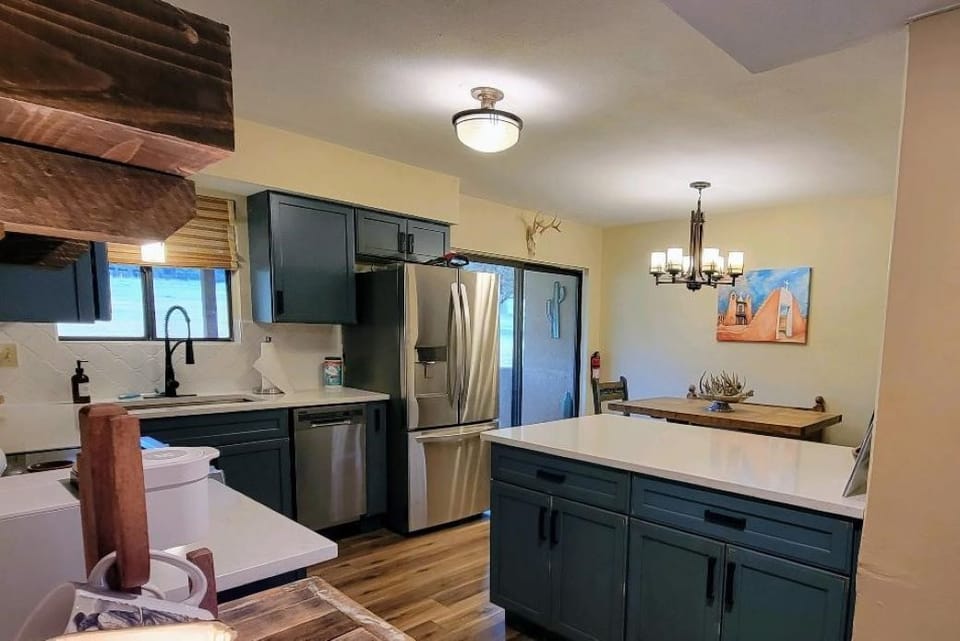 The kitchen overlooks the covered patio and has sliding glass doors to outside.