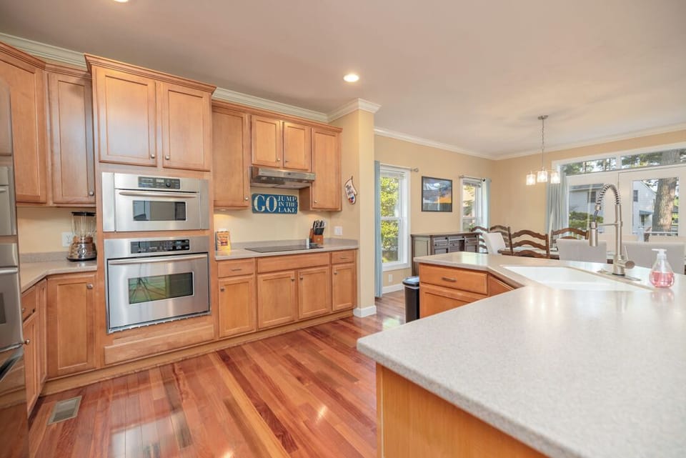 Step into Our Fully Stocked Kitchen with Central Island.