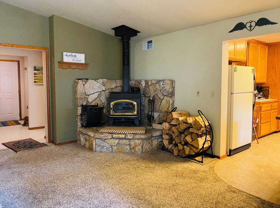 Wood Stove with plenty of wood for a warm cozy Fire