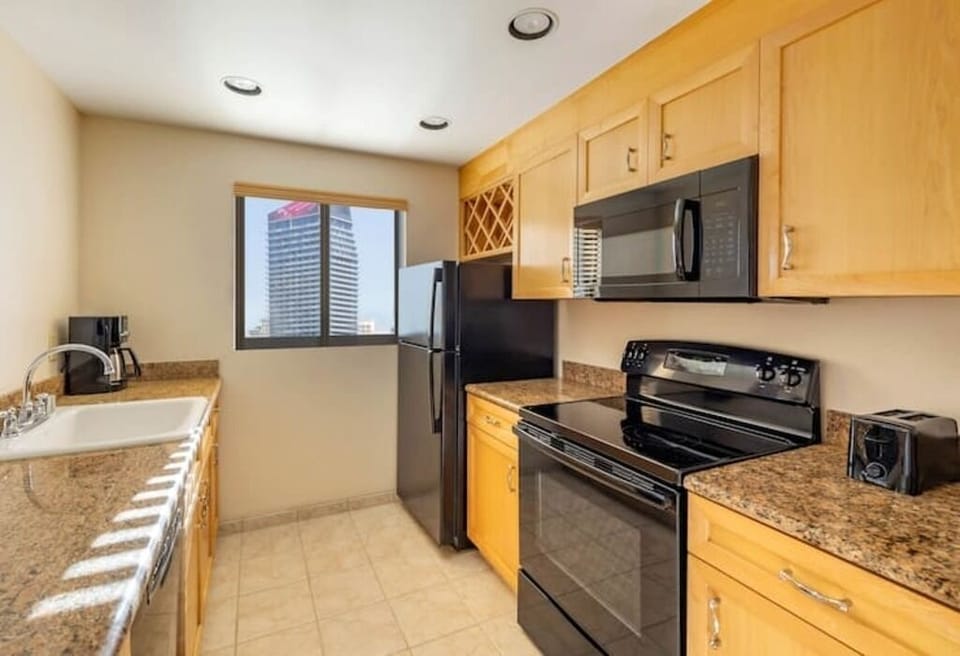 Cook with ease in a full kitchen with modern appliances.