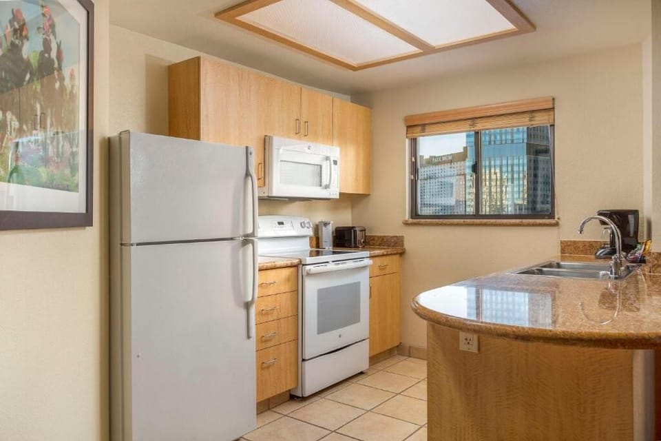 Start mornings with coffee and skyline views by the sink.