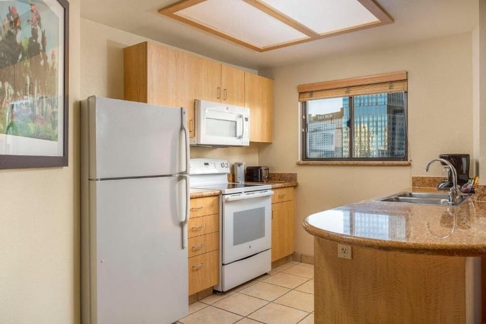 Start mornings with coffee and skyline views by the sink.