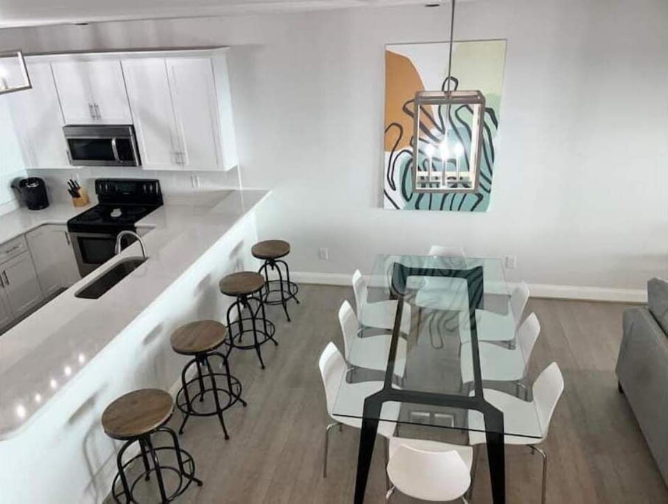 Kitchen/Dining.  White cabinets, new SS appliances and solid surface countertops