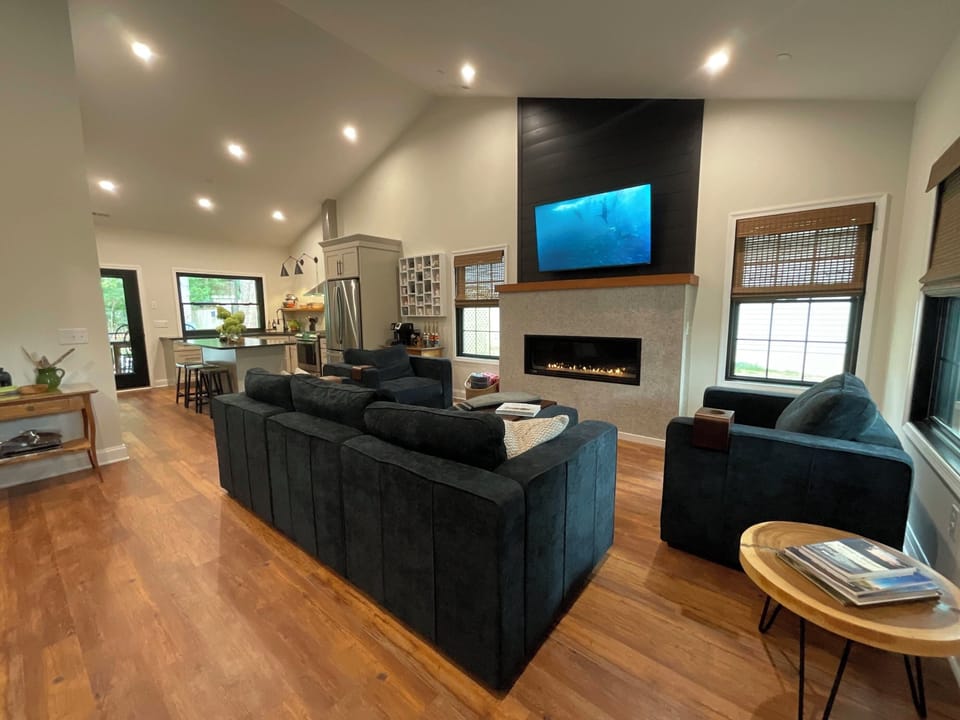 Open space living room and kitchen with cathedral ceilings