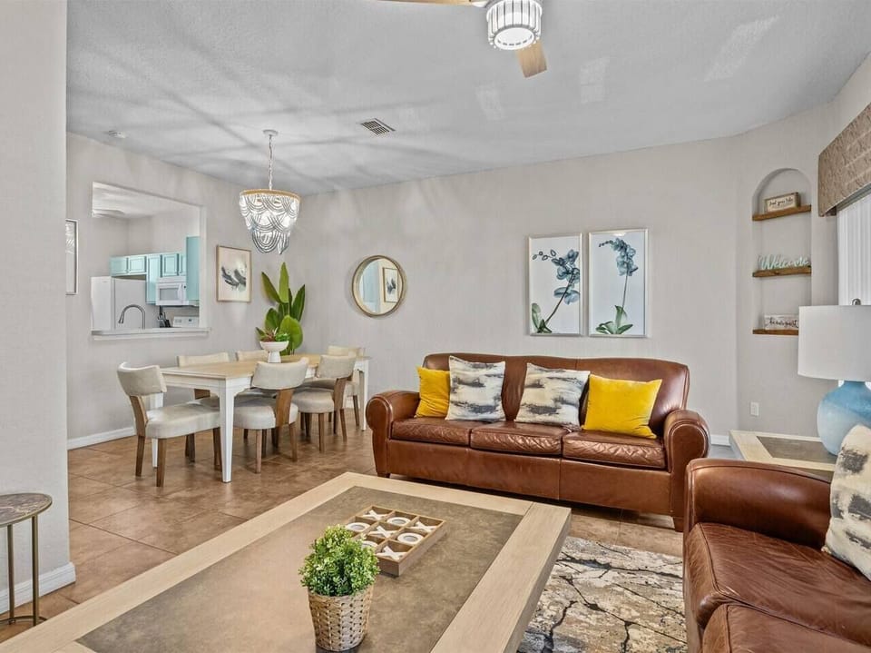 Gather the family in the heart of the home! The living room offers a comfy sofa and a great selection of board games for everyone to enjoy. The open layout flows seamlessly into the dining area, making it the perfect space for shared meals.
