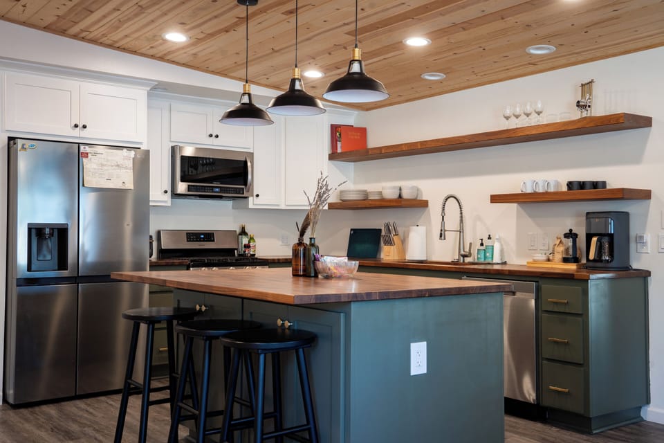 The beautiful open kitchen and dining space is fully equipped (less the food).
