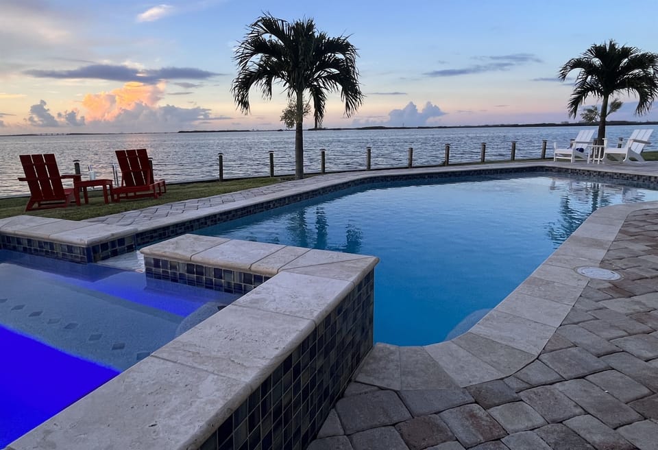 Enjoy the beautiful riverfront views while relaxing in the pool and spa