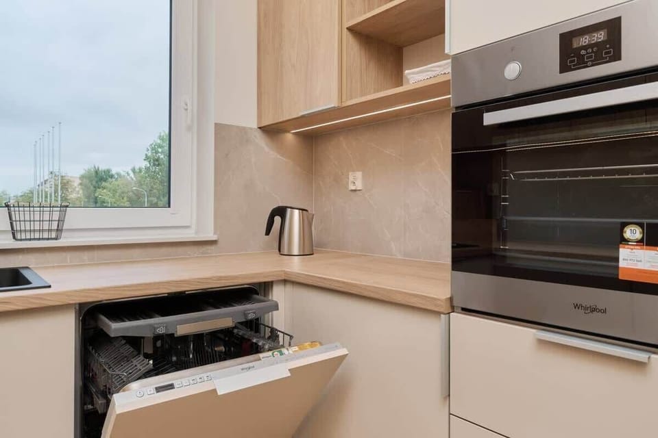The kitchen appliances including a built-in oven and stove, creating a fully equipped cooking space.
