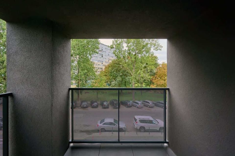 A balcony space with a peaceful view of the surrounding area, offering a tranquil outdoor retreat.
