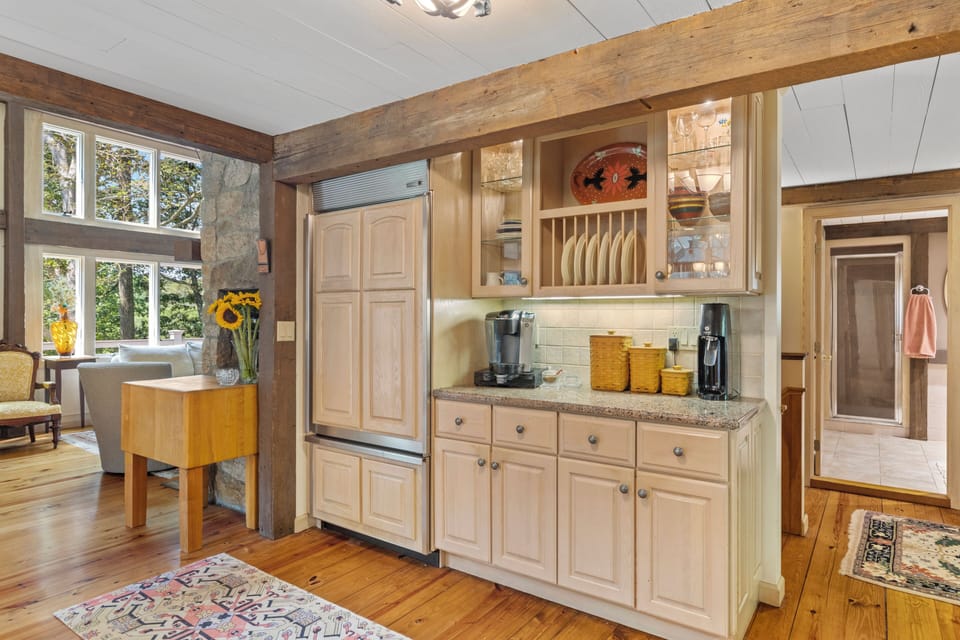 Open kitchen design contains Sub Zero refrigerator and granite counter tops. 