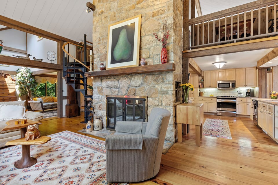 Living area with spiral staircase to master bedroom