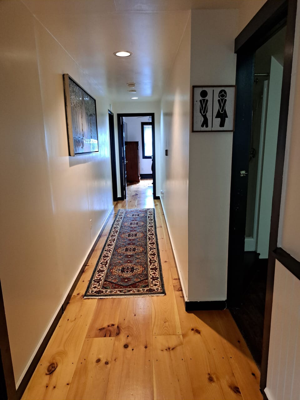Twin to left; shared bath to right. King room end of hall, 2 queens end/left