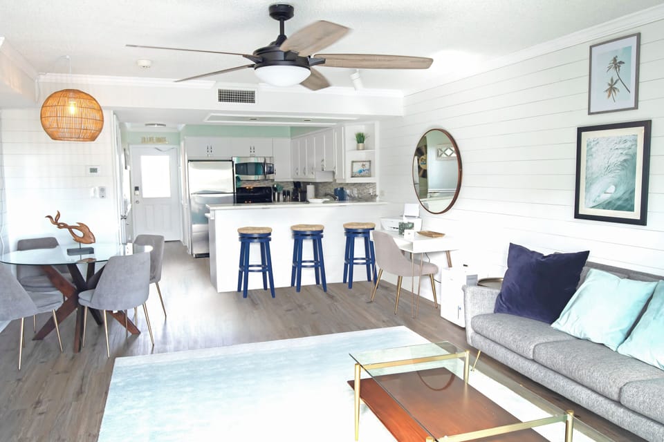 Open floor plan facing beach & pool. Desk w/ wifi printer, bar w/ seating for 3.