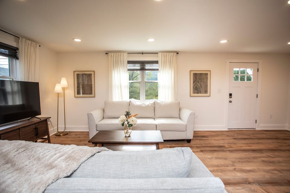Living room with plush couches and beautiful views
