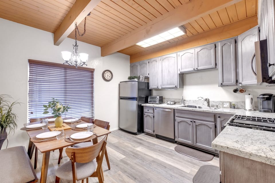Fully-equipped kitchen with modern appliances and ample storage.