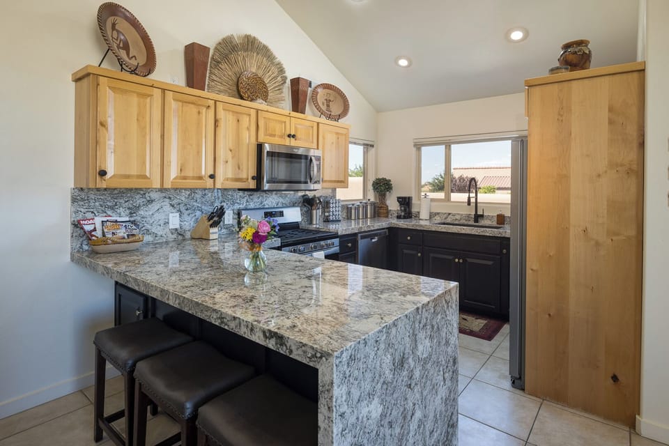 Fully Stocked Kitchen with Breakfast Bar - Seating for Three (3)