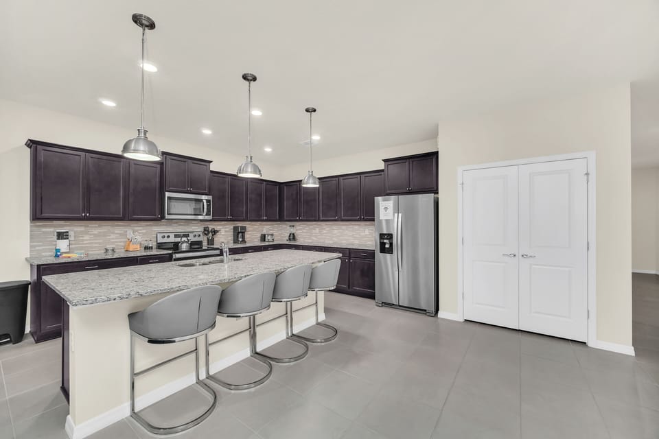 Beautiful, updated kitchen with modern amenities and appliances, and bar seating for 4