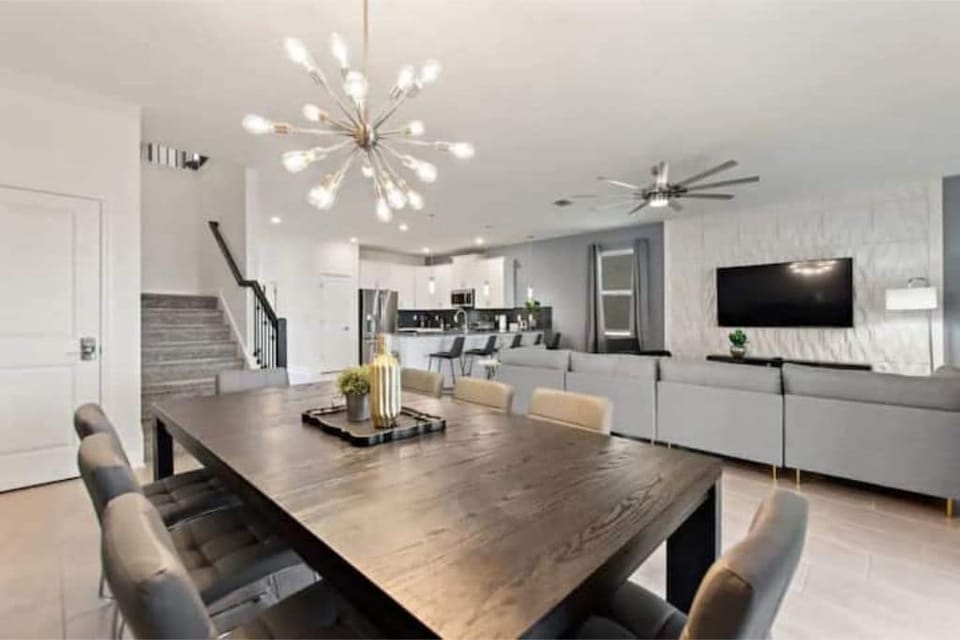 Dining Area that Seats 8 People, Living Room & Kitchen Area in Background