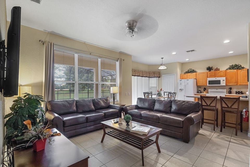 Back Living Room With 47" HD TV With Kitchen In Background