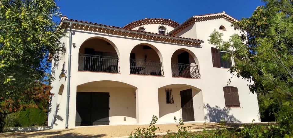 Front of house including balcony