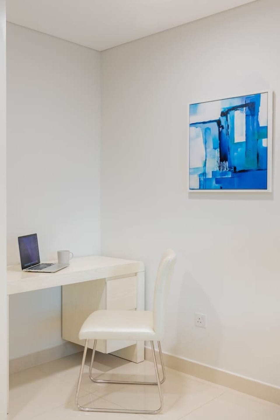 Workspace Retreat: Bright, sleek desk for productivity and creativity amid artistic vibes!