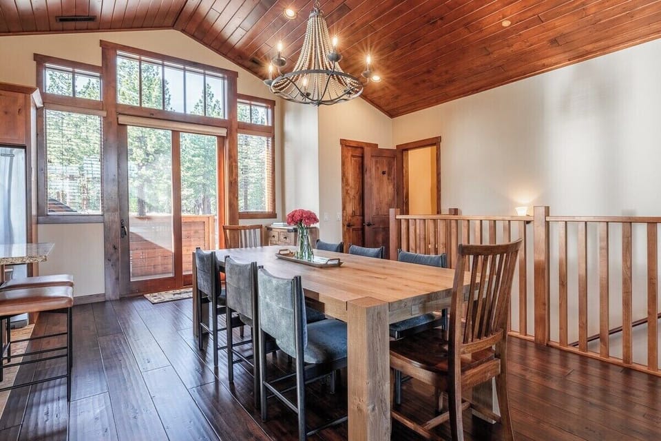 8 Person dining room table with bar seating for overflow seating.